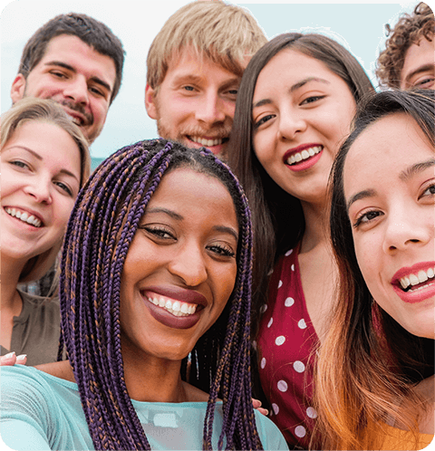 A group of people that are smiling for the camera.